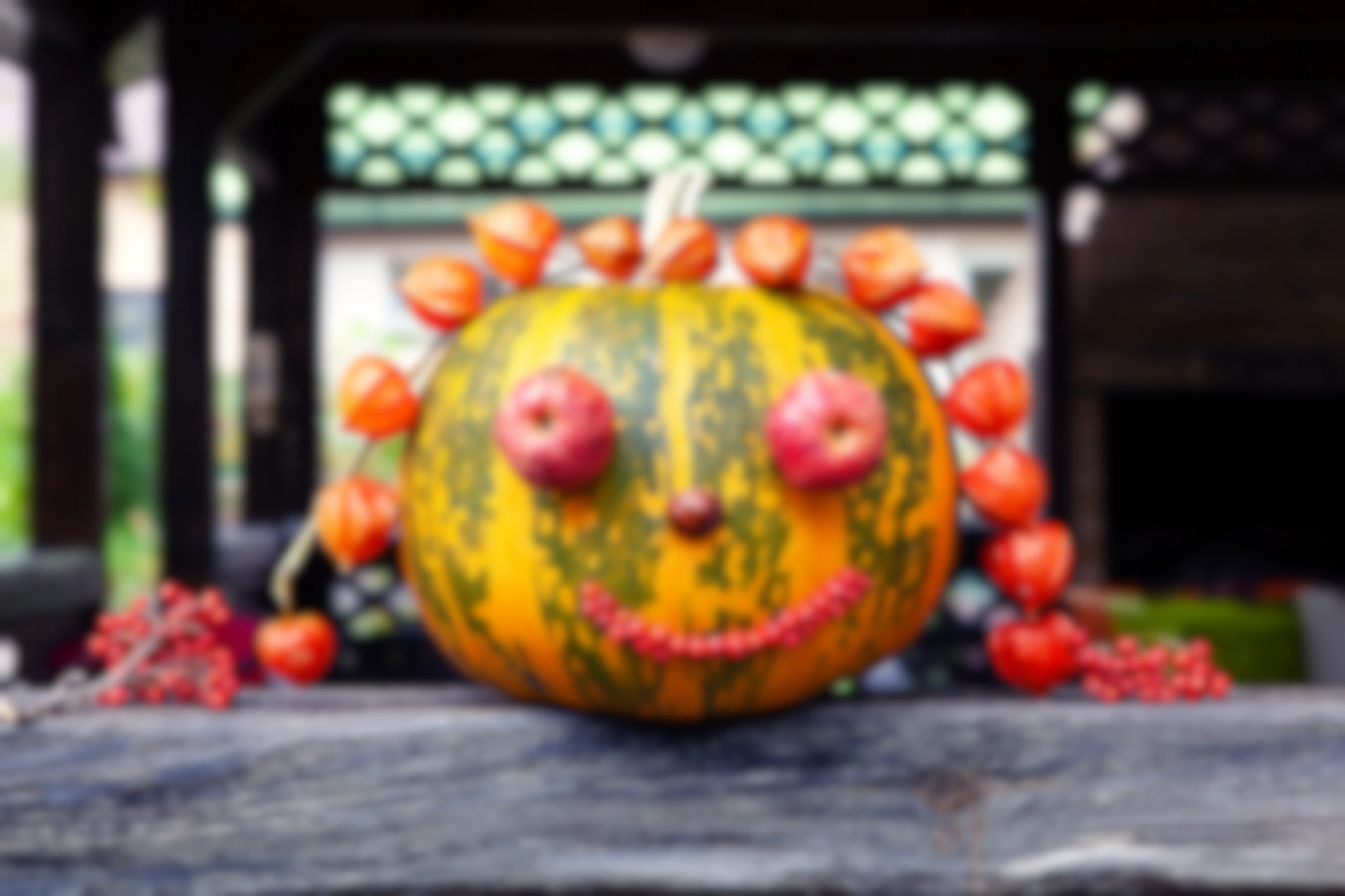 Pumpkin decorated with fruit and vegetables