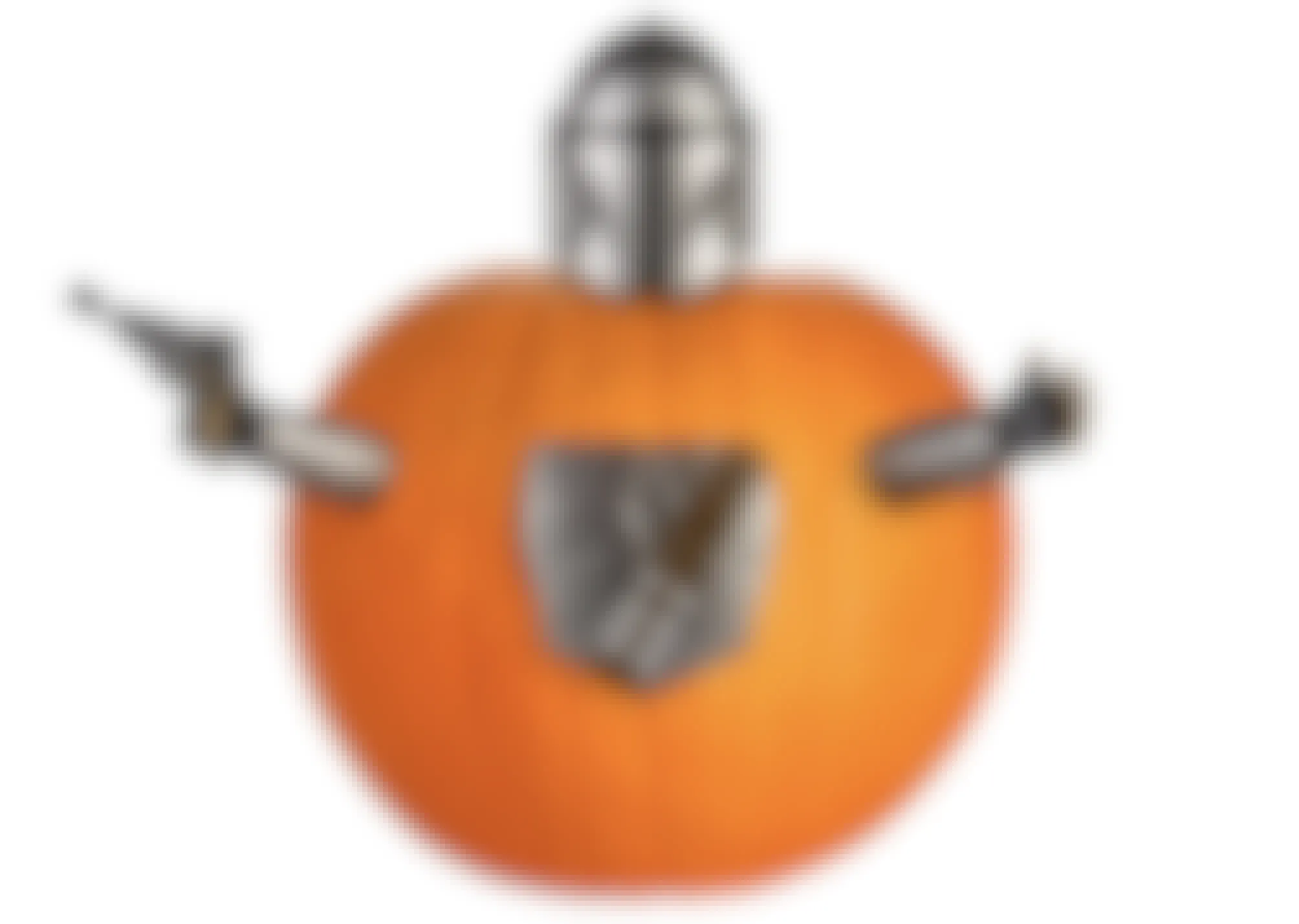A pumpkin with arms, helmet, and shield attached to the outside of it.
