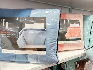 display of reversible comforters in different colors