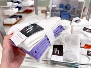 someone holding a 6-pack of washcloths