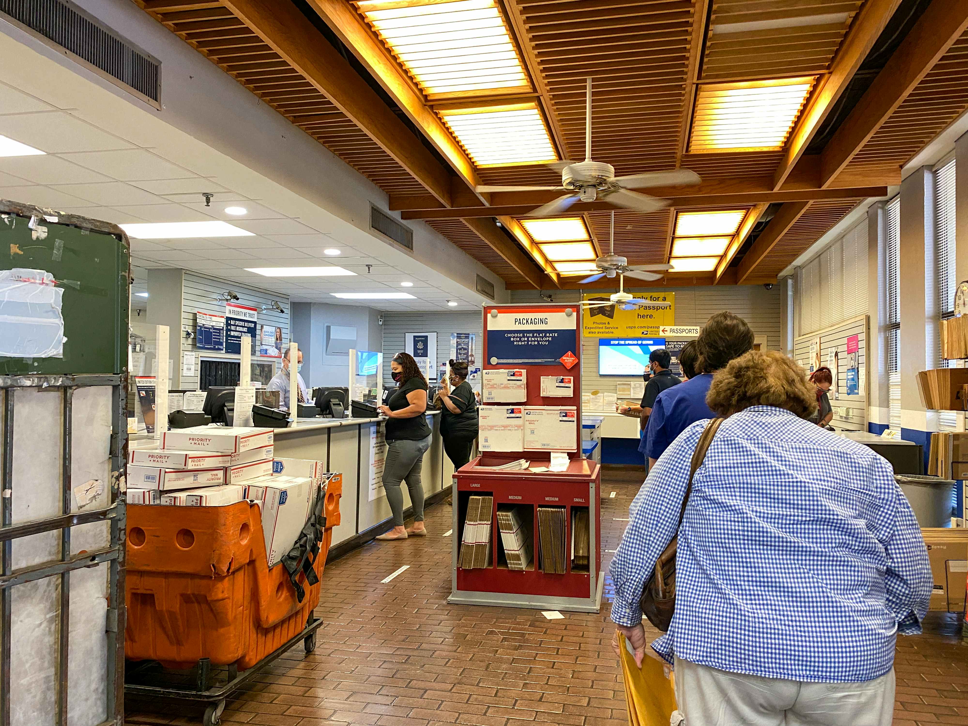 People standing in line at a post office.