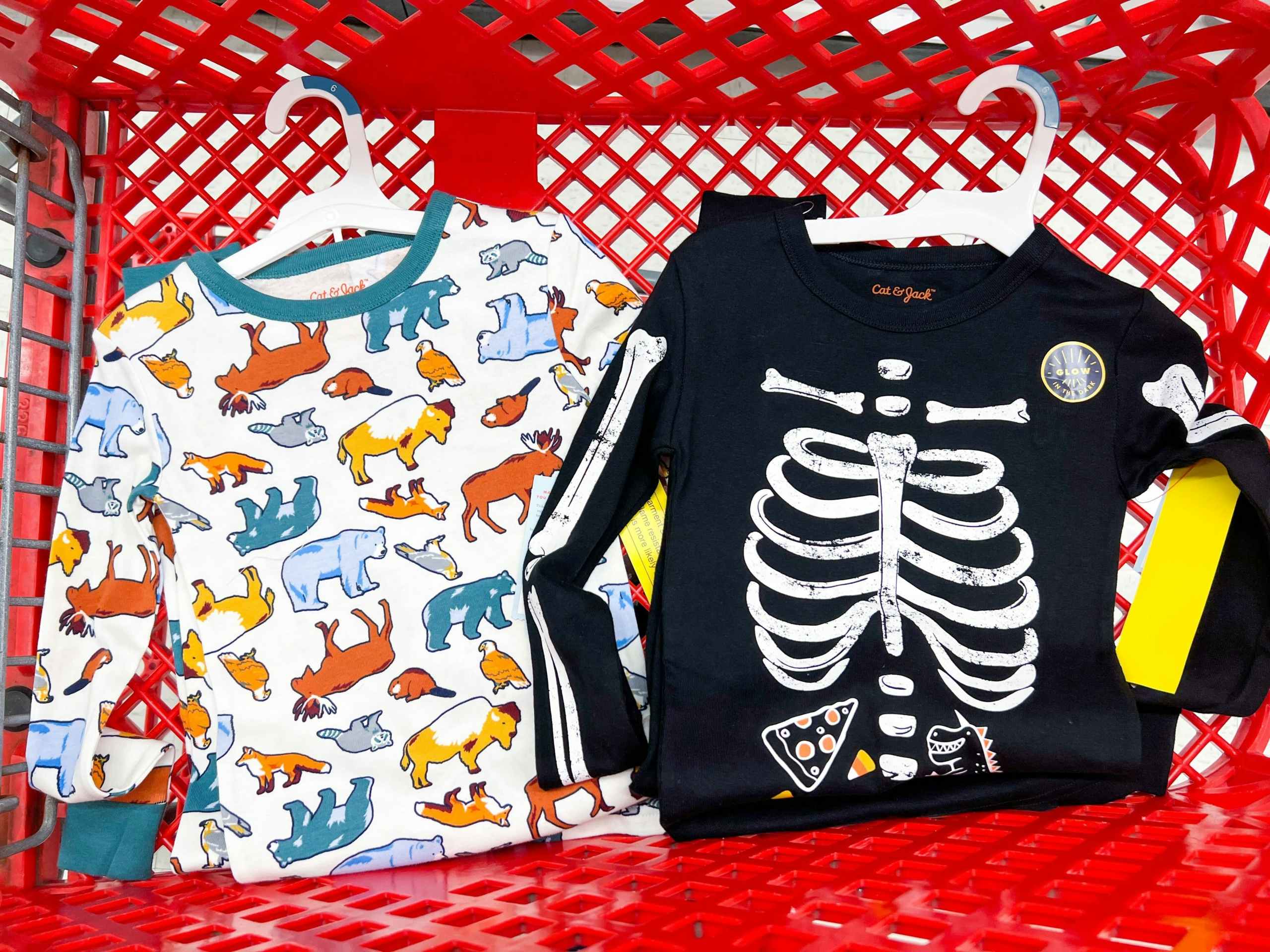two pairs of kids pjs in a target cart