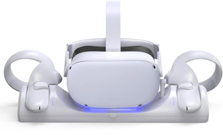 A Meta Quest 2 on a charging station with its controllers