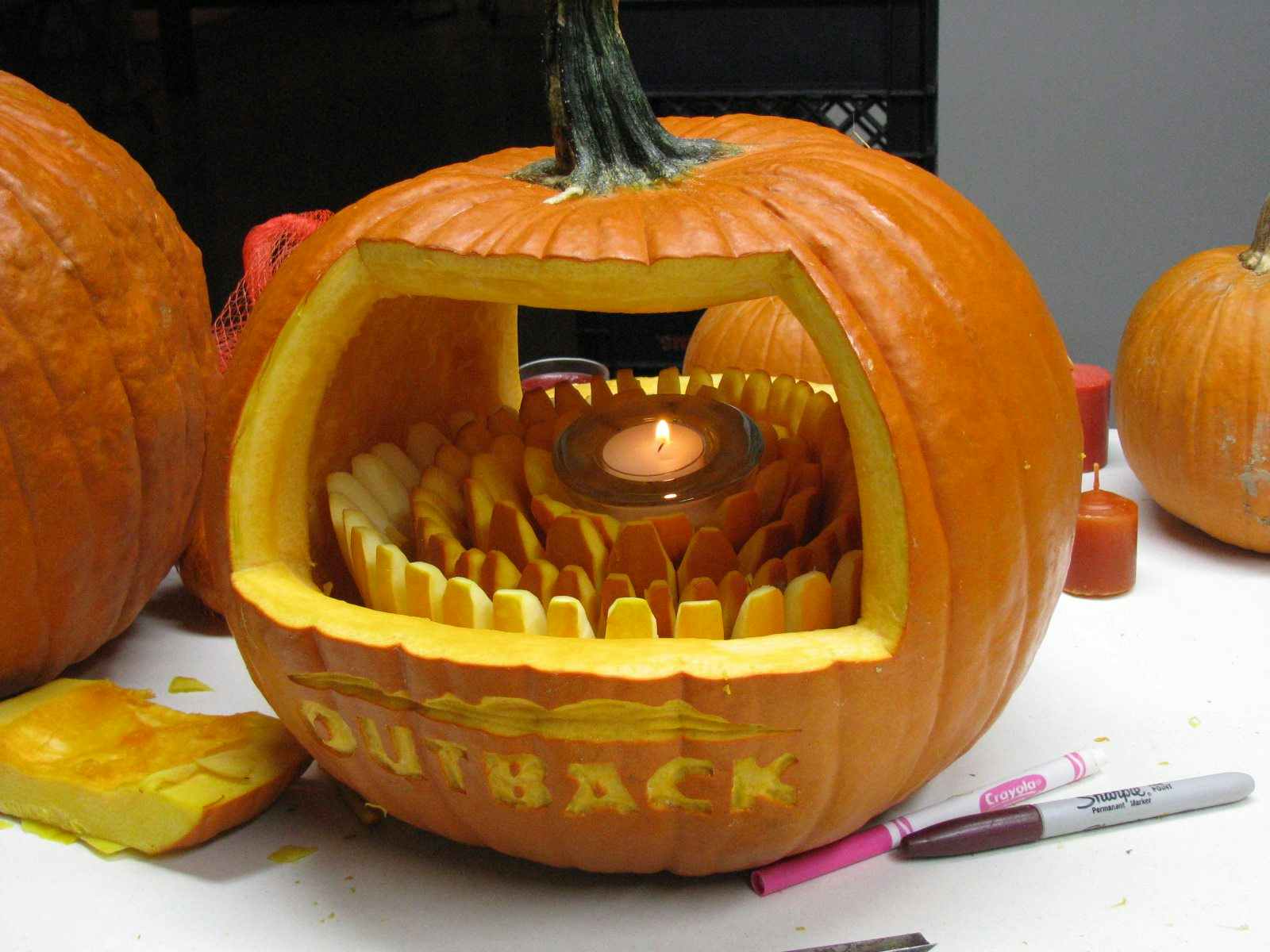 Pumpkin carved with the outback steakhouse logo and a bloomin onion inside