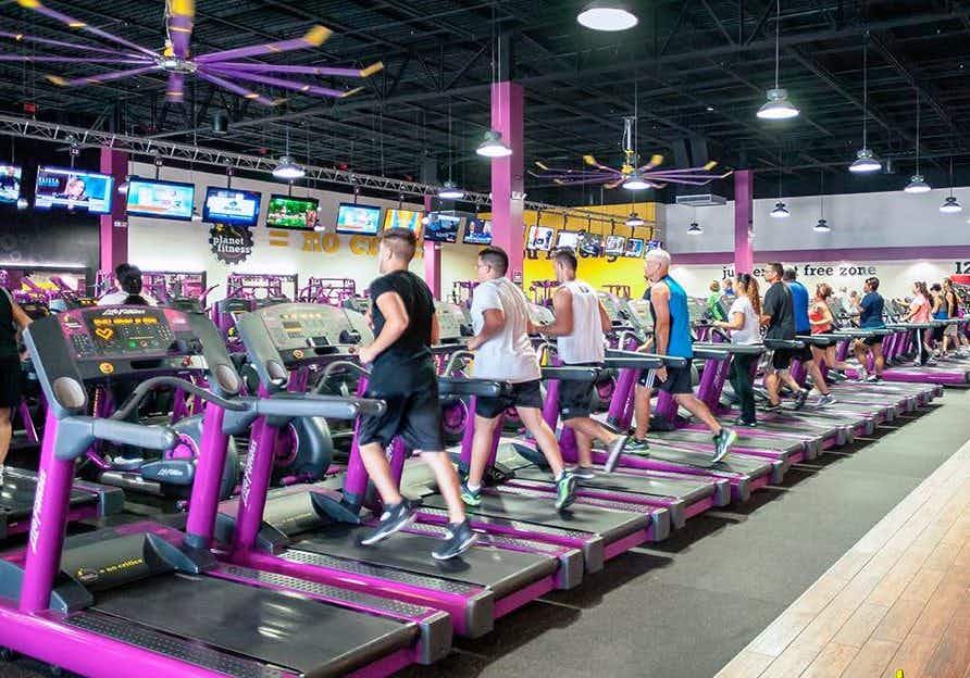 People on exercise equipment at Planet Fitness