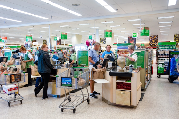 People at the checkout inside Publix