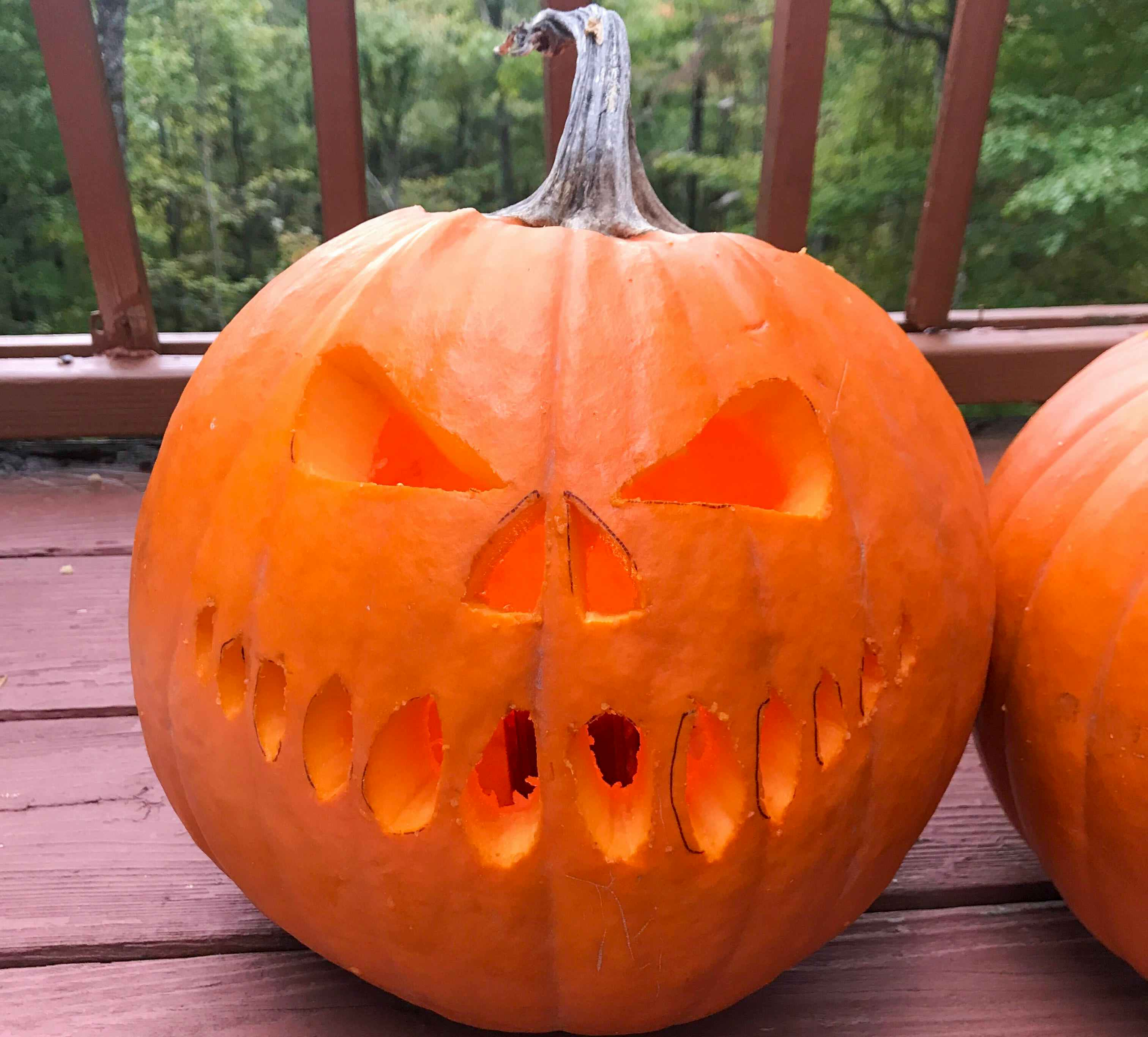 a pumpkin carved with a scary face