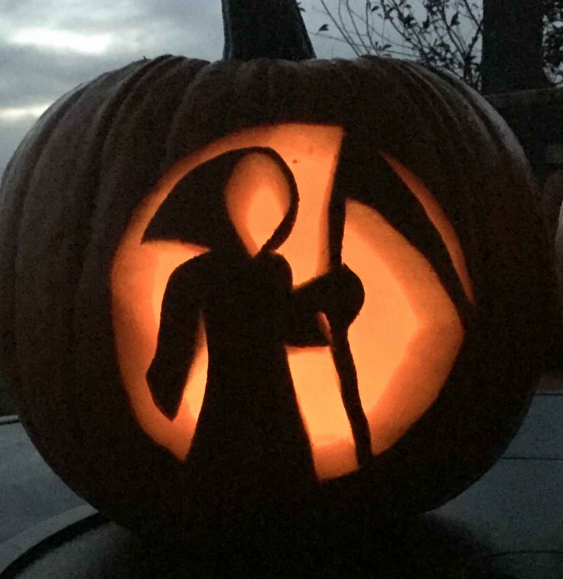 A grim reaper carved in a pumpkin.