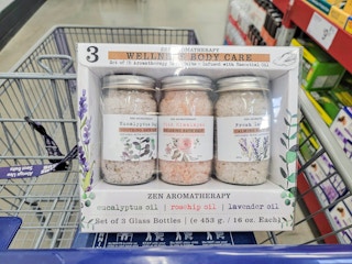 a box of 3 jars of aromatherapy bath salts in a cart