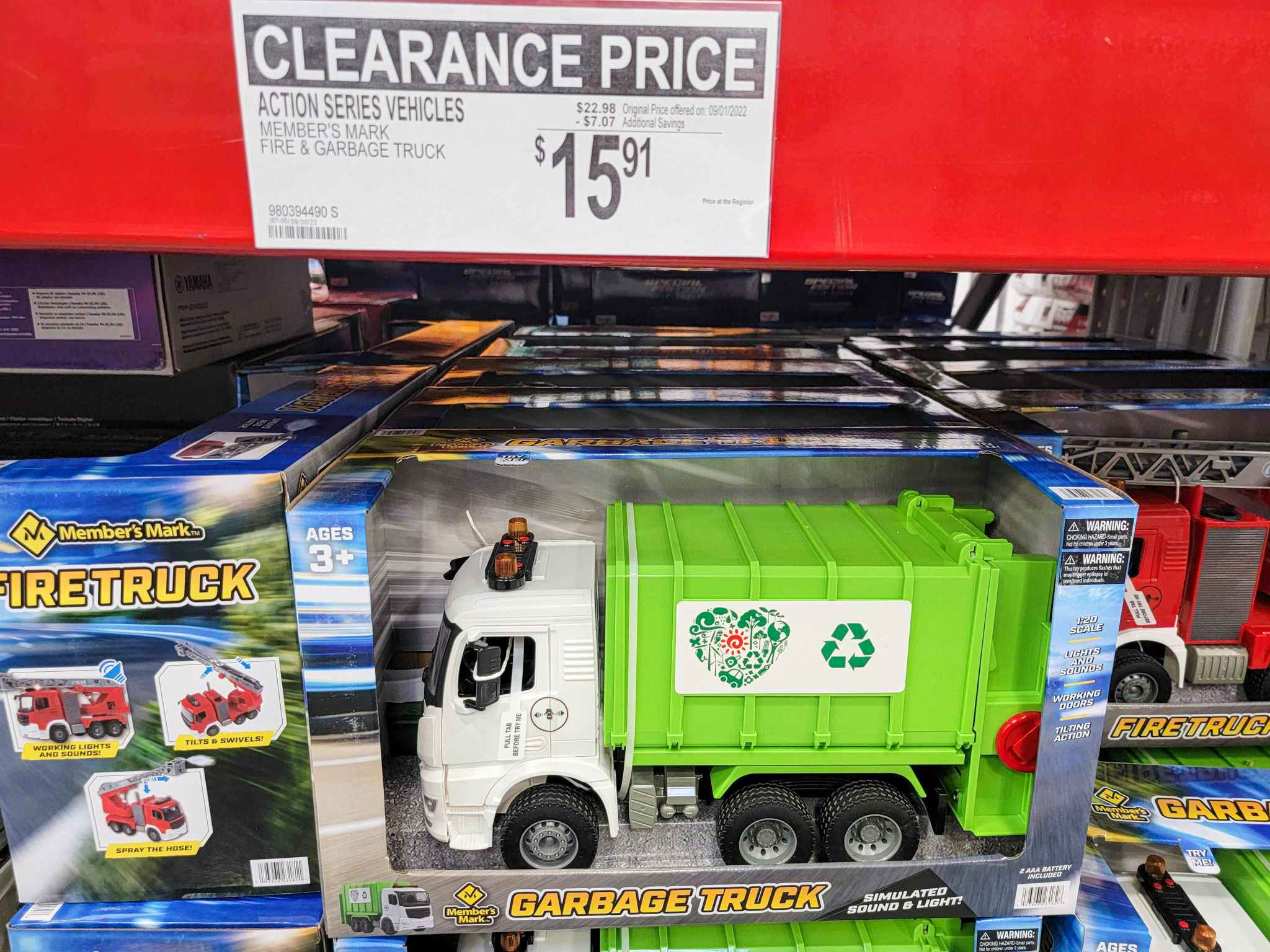 garbage truck toy with a 15.91 clearance tag