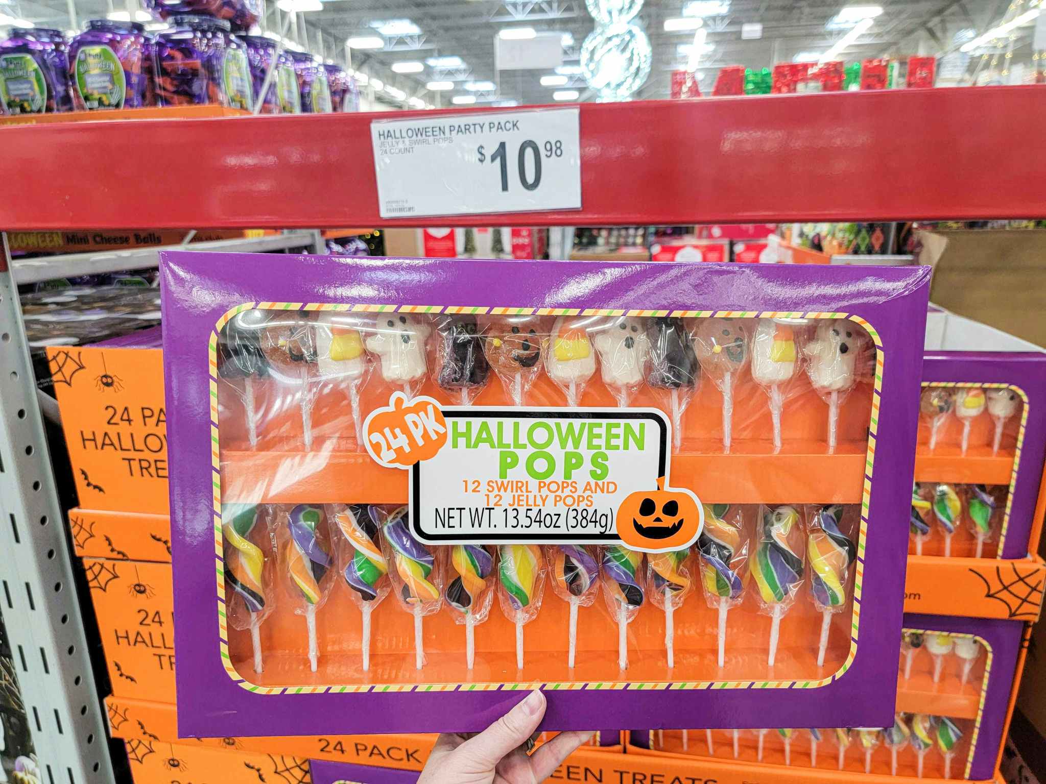 hand holding a box of 24 halloween jelly & swirl pops 