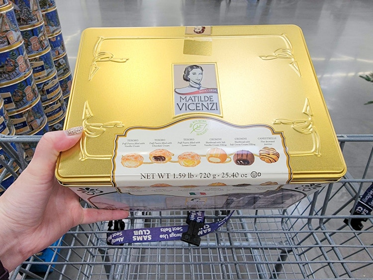a tin of pastry cookies in a cart