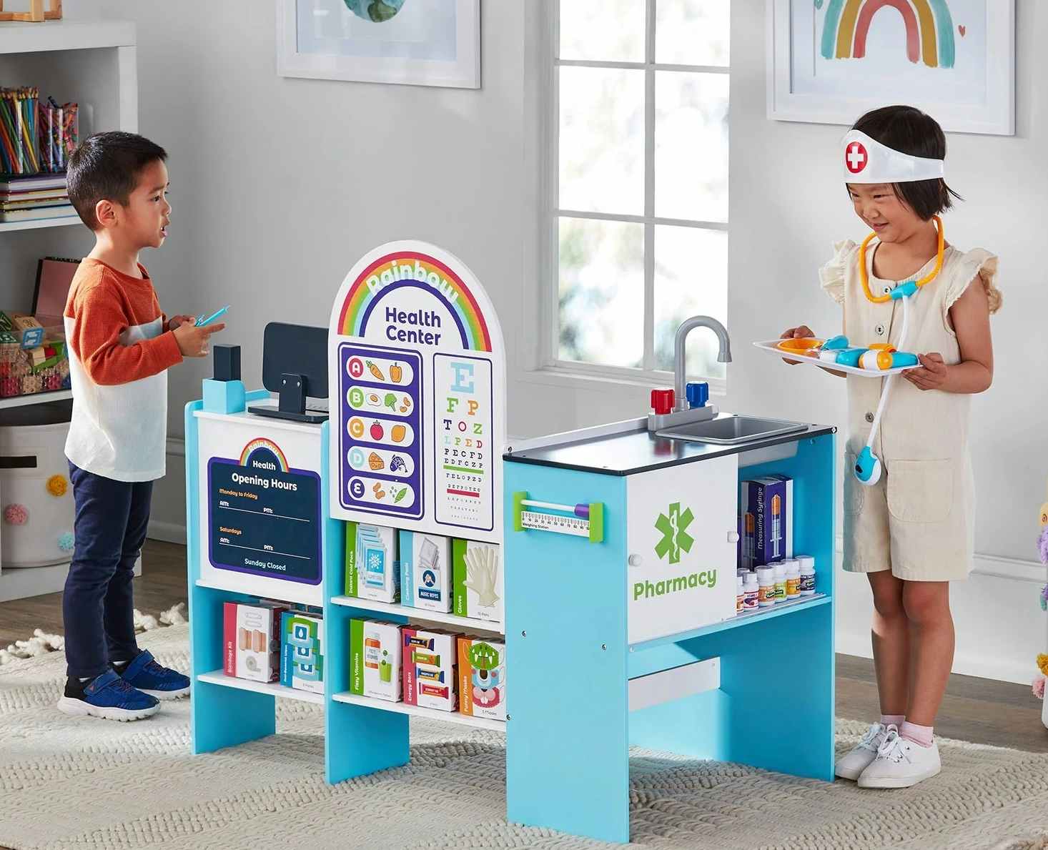 kids playing with a health center toy