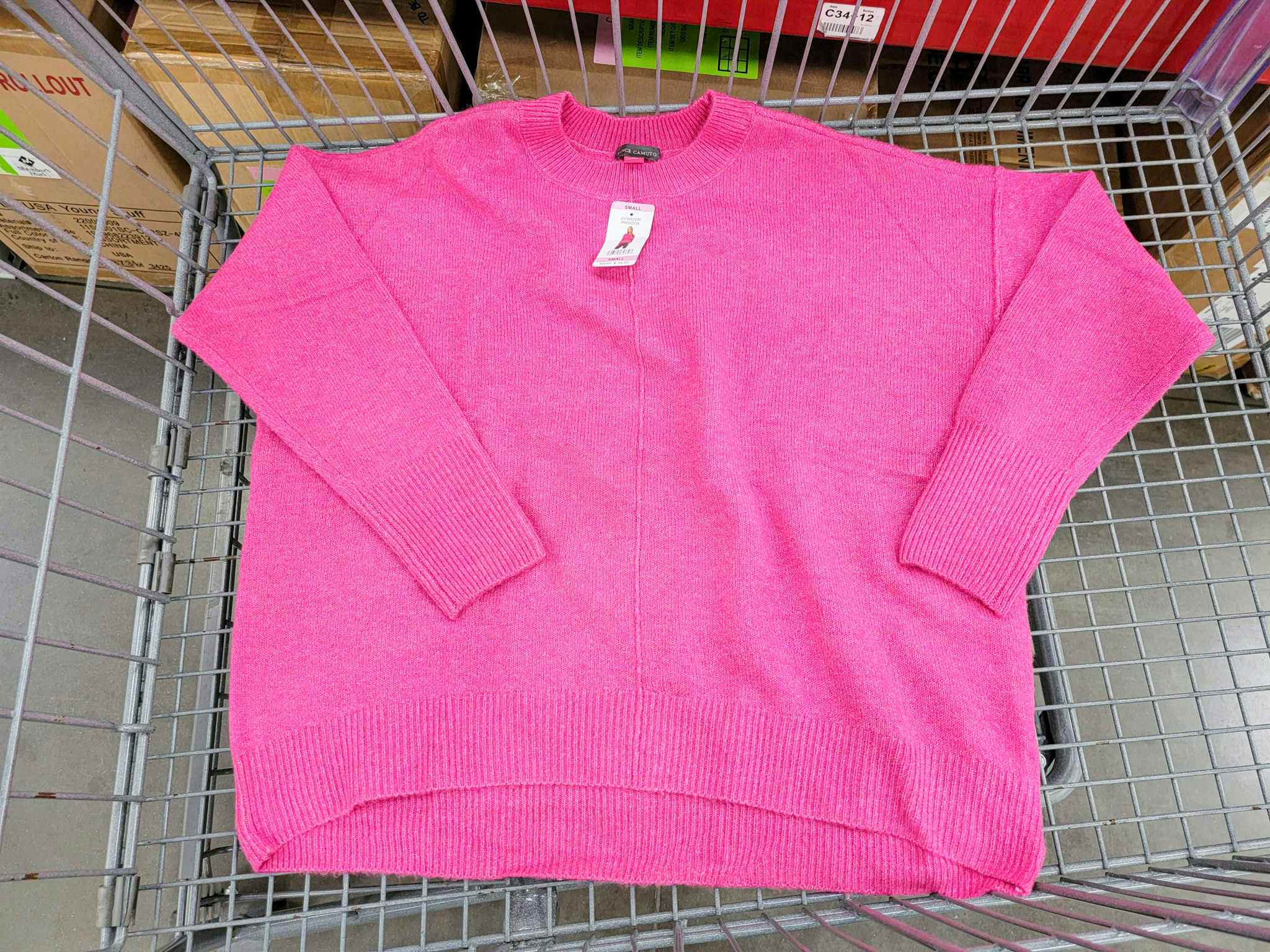 pink sweater in a cart