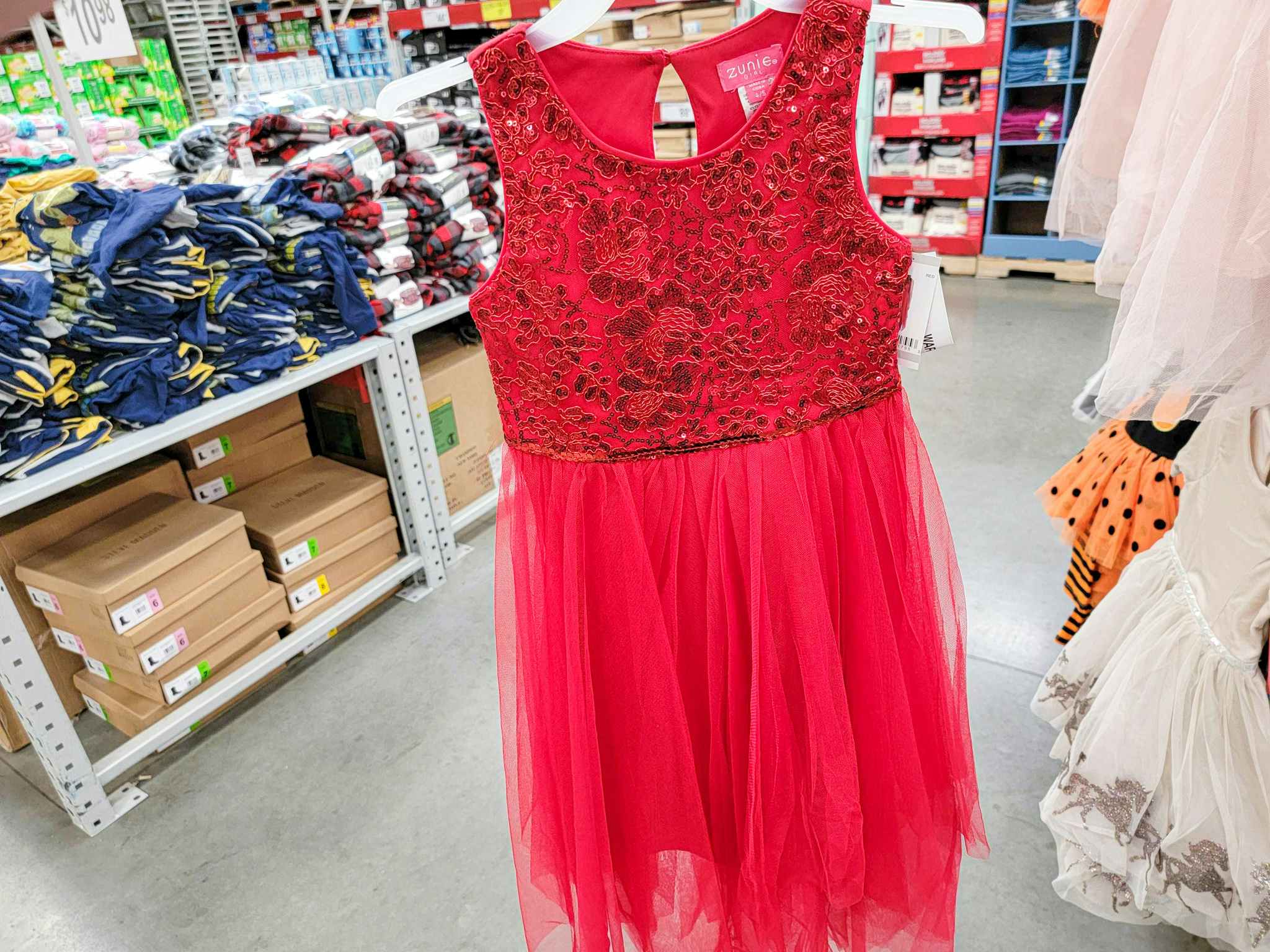 a red kids dress with a sequin top