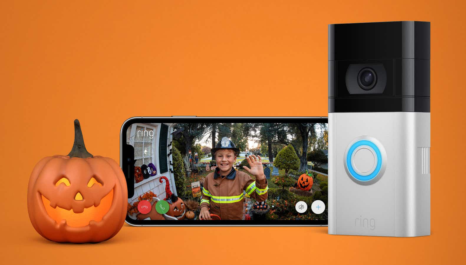 A Ring video doorbell camera next to a phone displaying a video feed and a pumpkin on an orange background