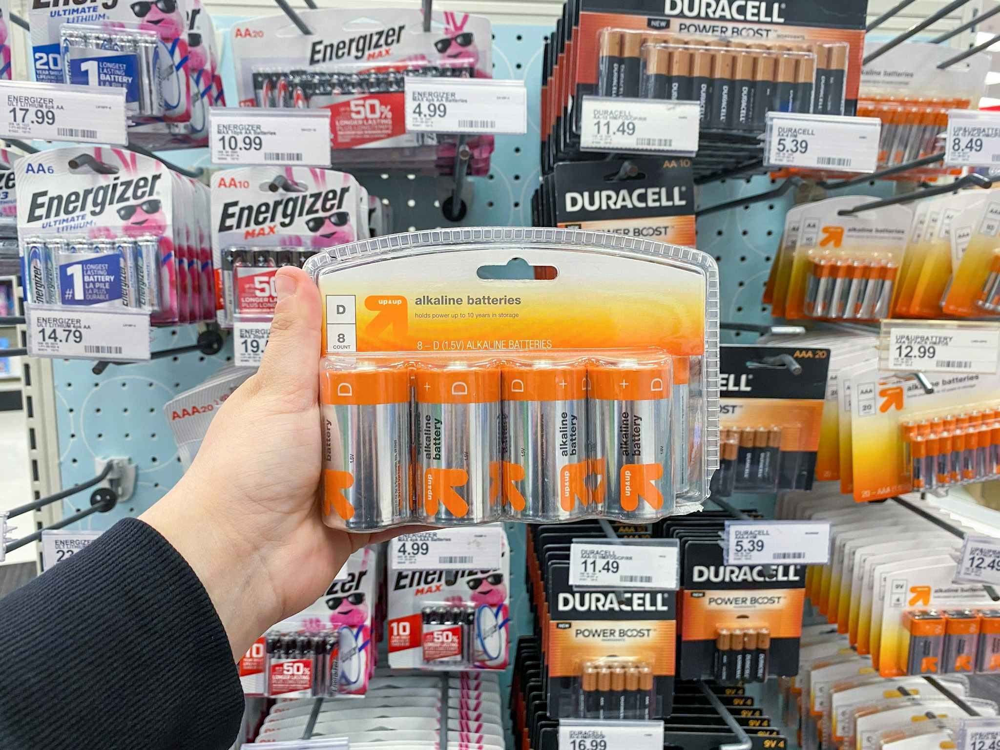 an 8 pack of Up & Up D alkaline batteries hanging among other battery packs at Target