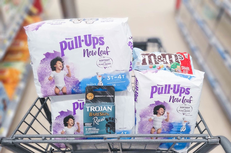 three packs of Pull-Ups New Leaf, M&M's, and a pack of Trojan in shopping cart