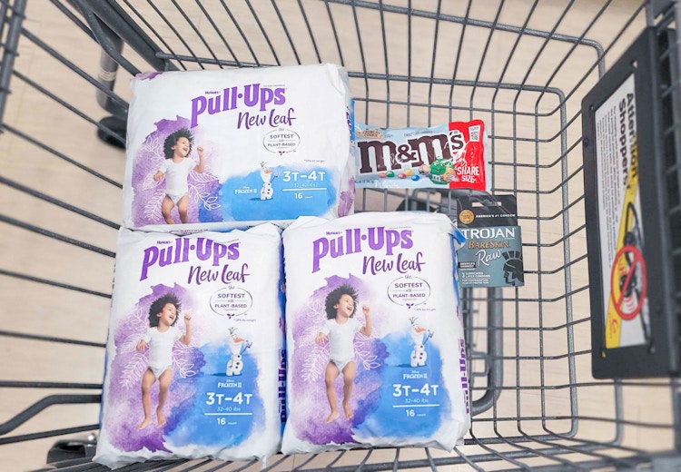 three packs of Pull-Ups New Leaf, M&M's, and a pack of Trojan in shopping cart