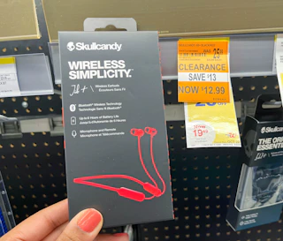 hand holding skullcandy wireless simplicity next to clearance tag