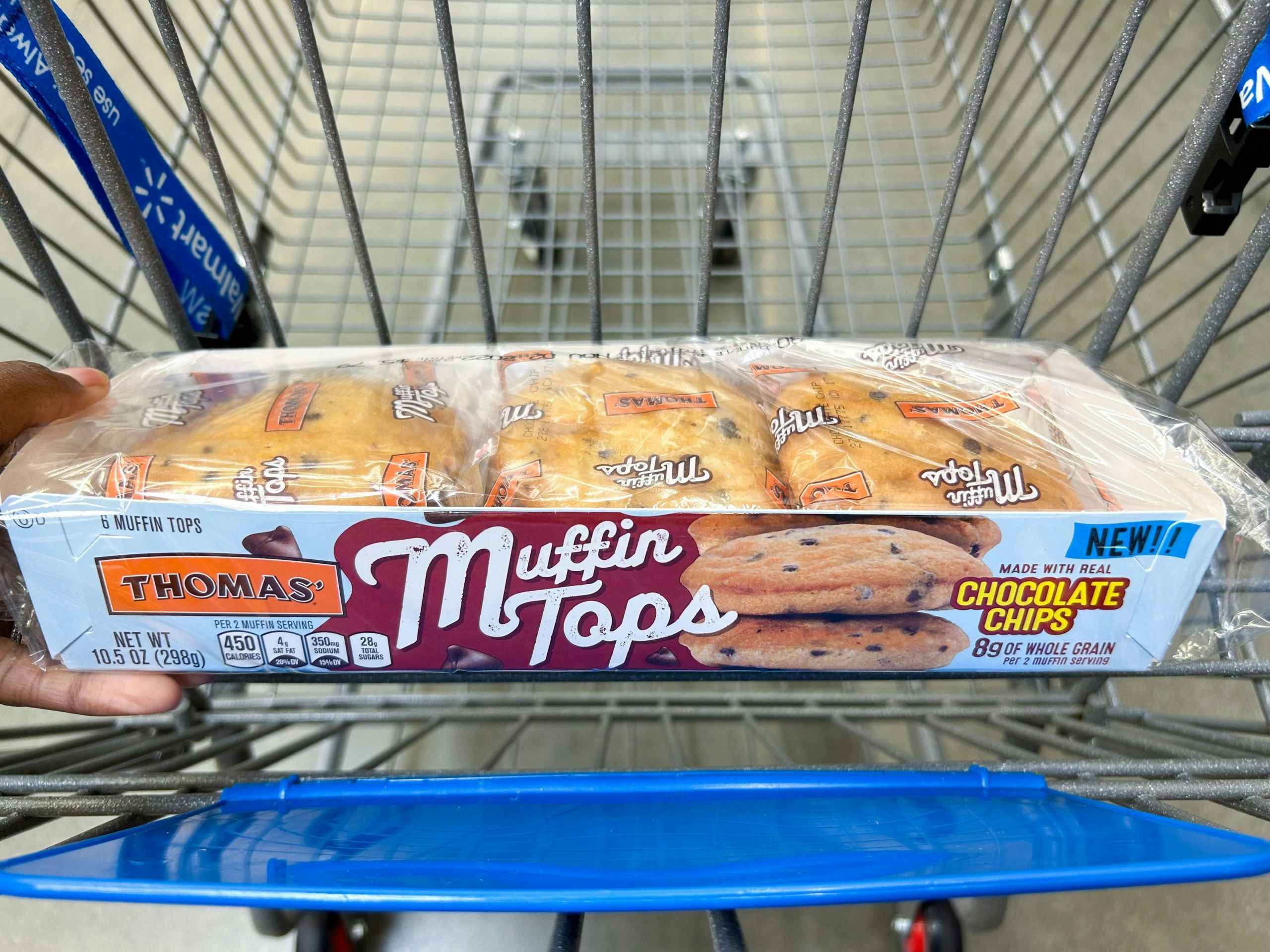 hand holding thomas muffin tops at walmart