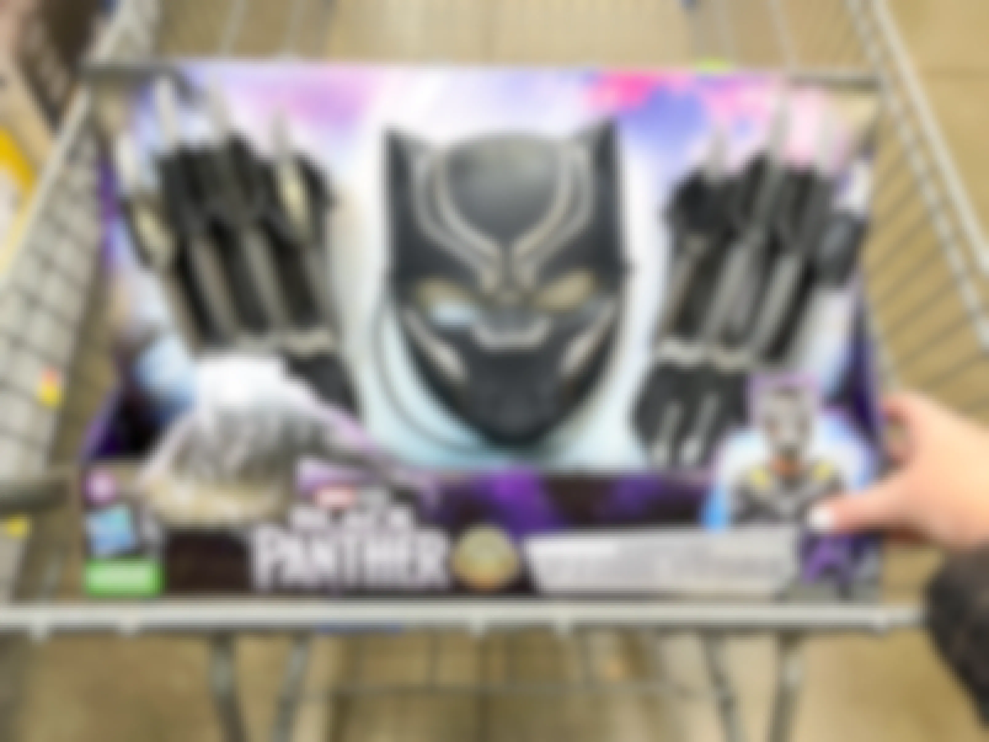 A Black Panther mask and claws set in a Walmart shopping cart