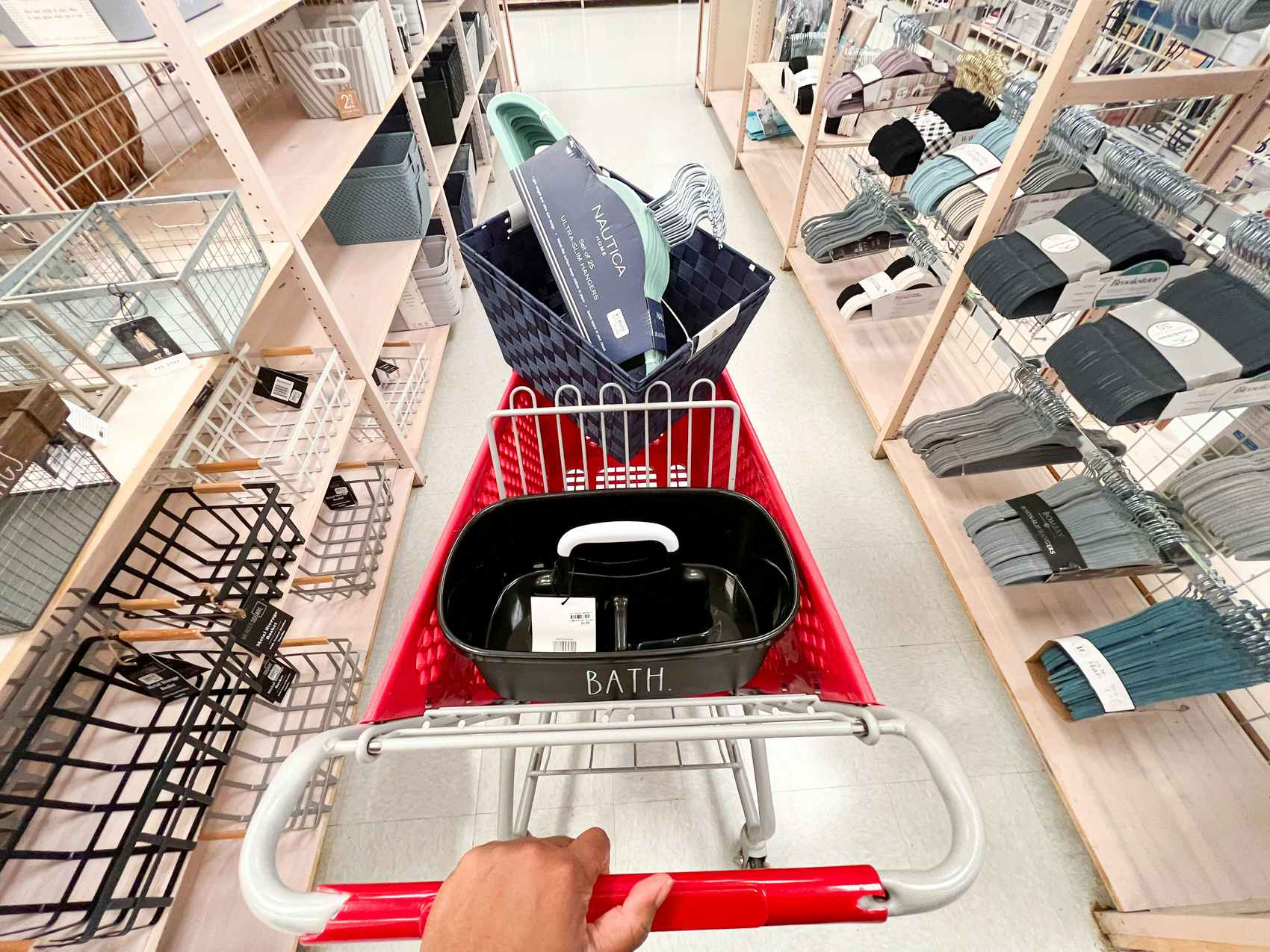 Hanger set, shower caddy and basket inside a bealls shopping cart