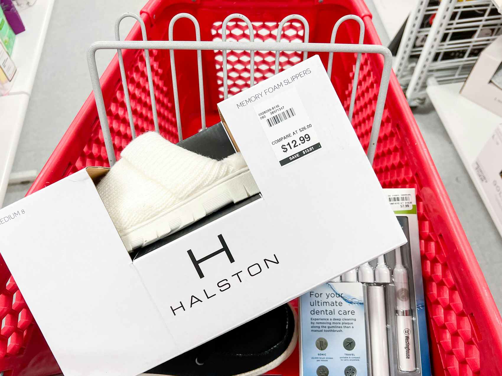 Halston shoes and toothbrush kit inside of a Bealls shopping cart