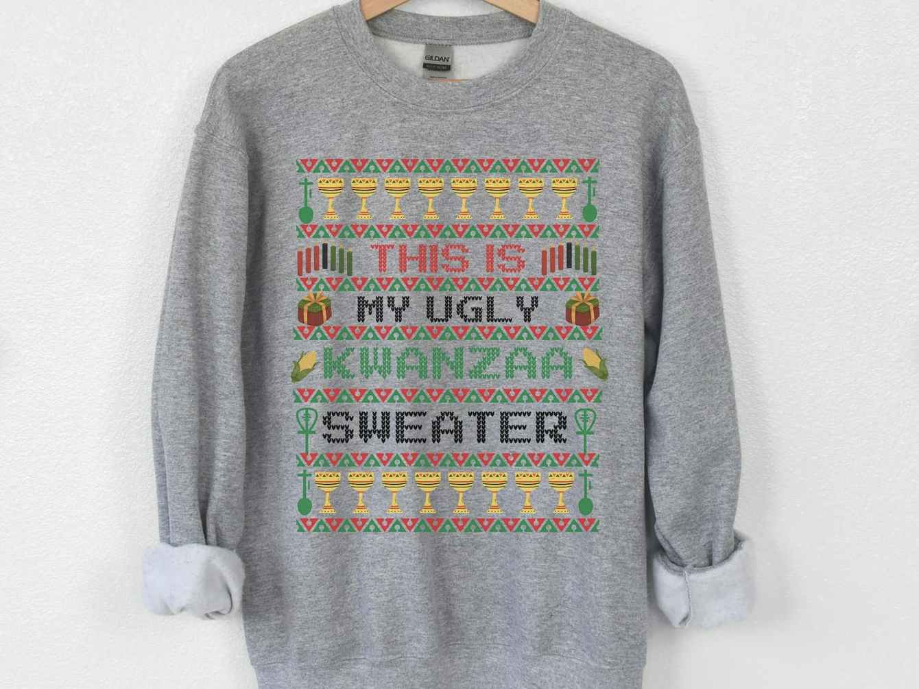 Grey sweater that reads, "this is my ugly Kwanzaa sweater