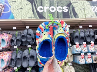 academy crocs fleece lined held up in front of crocs area shot