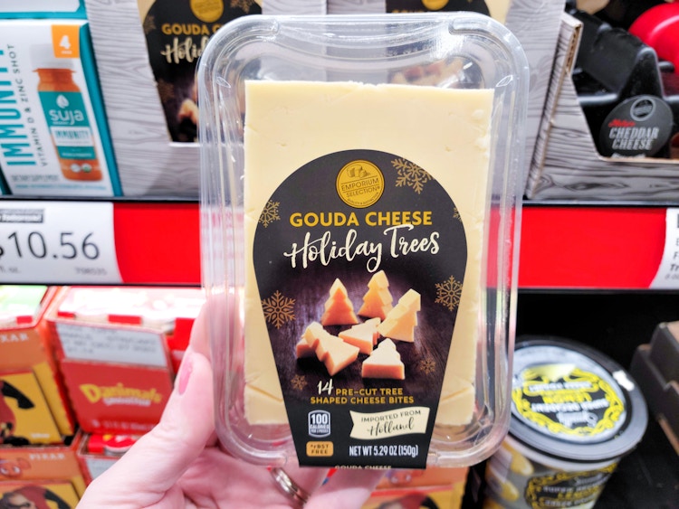 gouda cheese being held in adli store 