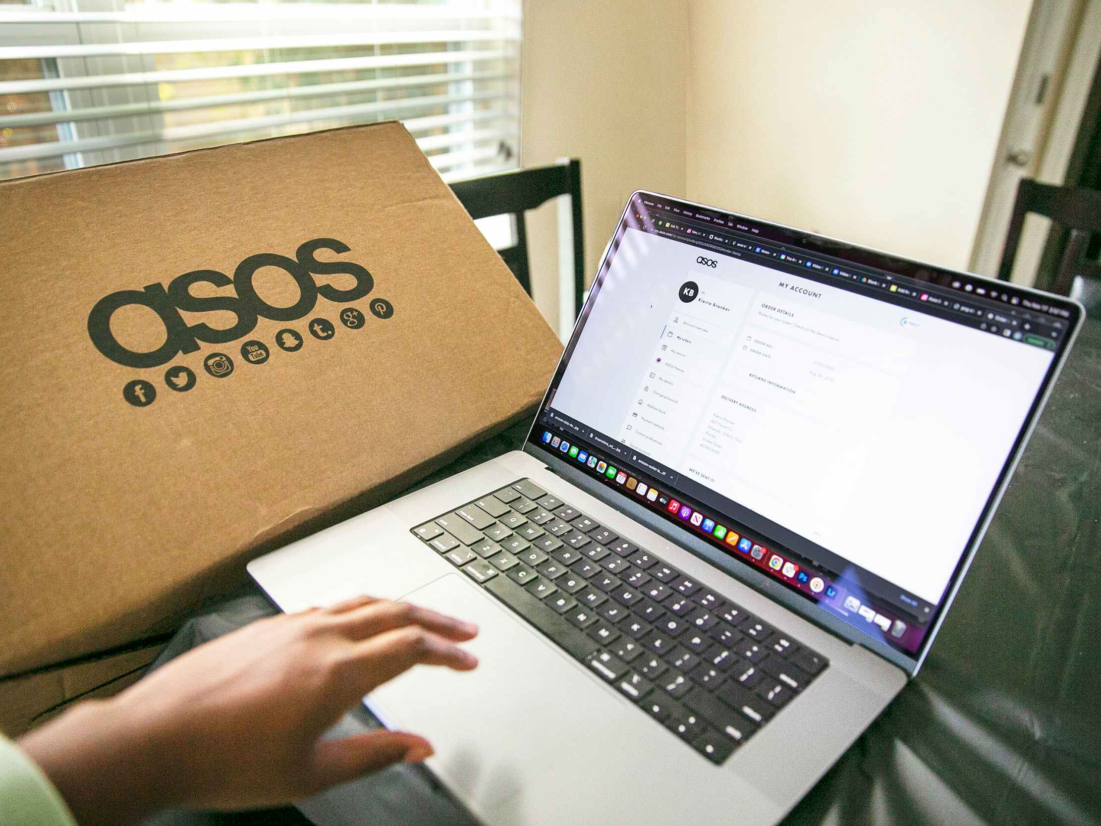 Person making a return on Asos website with box in the background