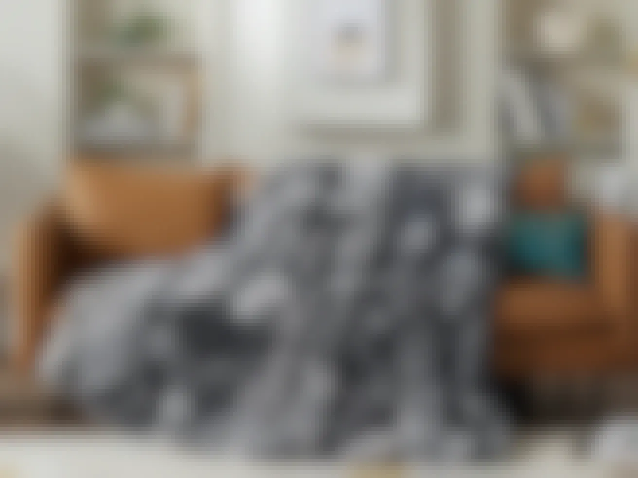 amazon gifts under $25 - A Faux Fur Throw Blanket draped over a sofa in a living room