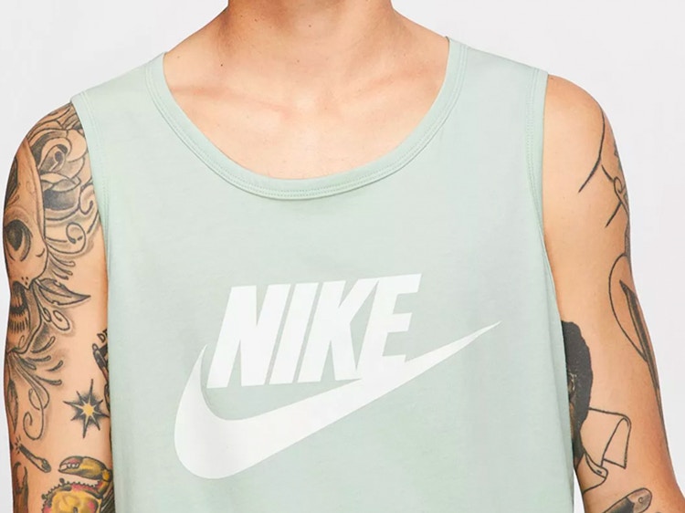 gifts for teens - A model wearing a Nike tank top