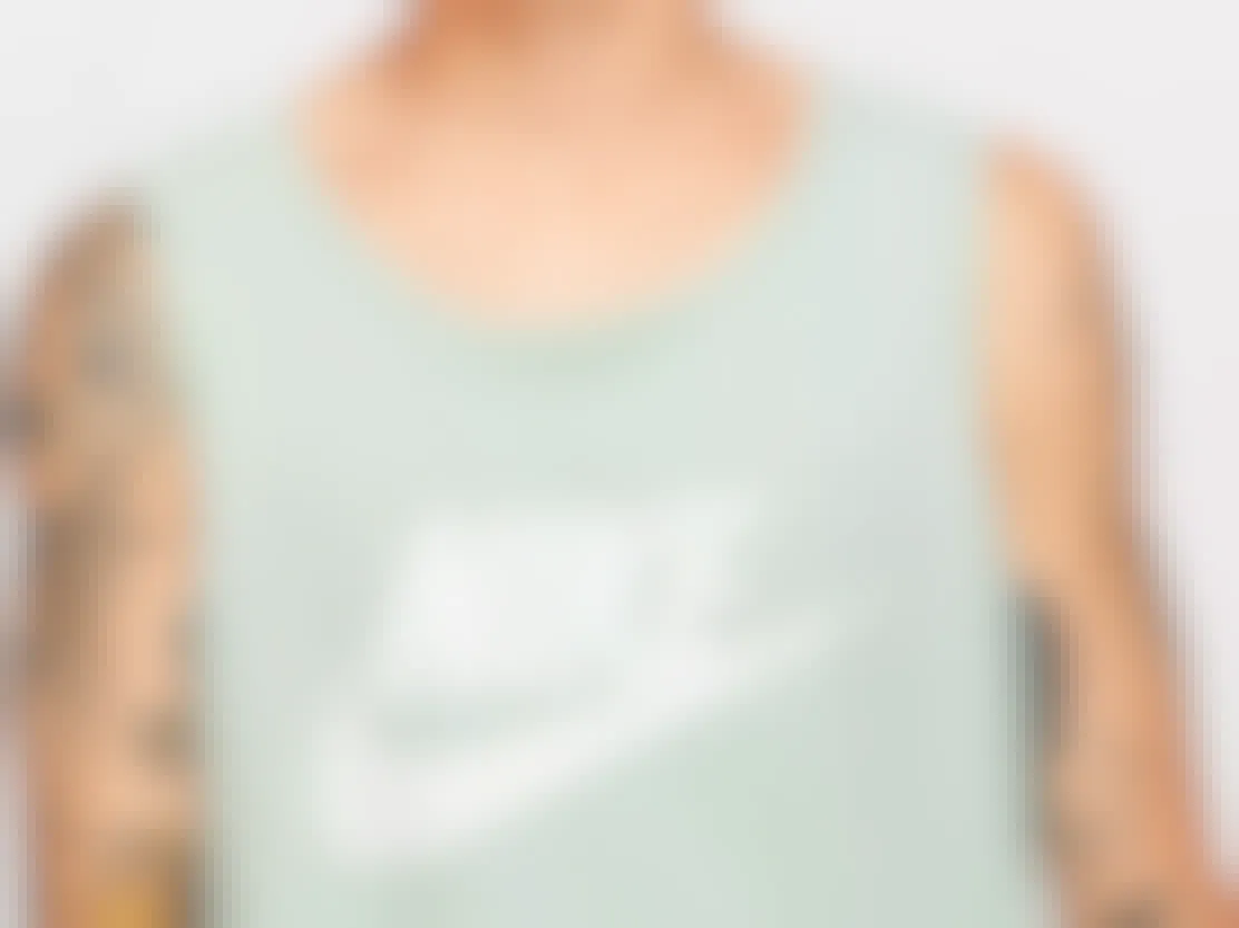 gifts for teens - A model wearing a Nike tank top