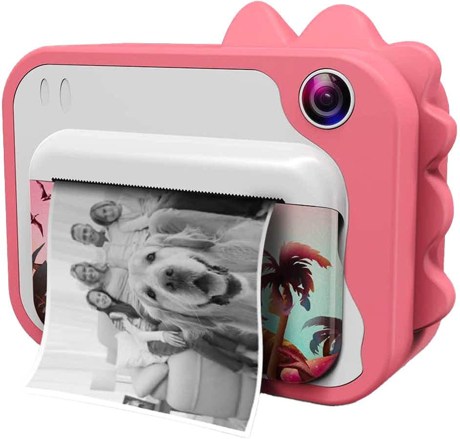 An instant camera printing out a photo of a family with a dog