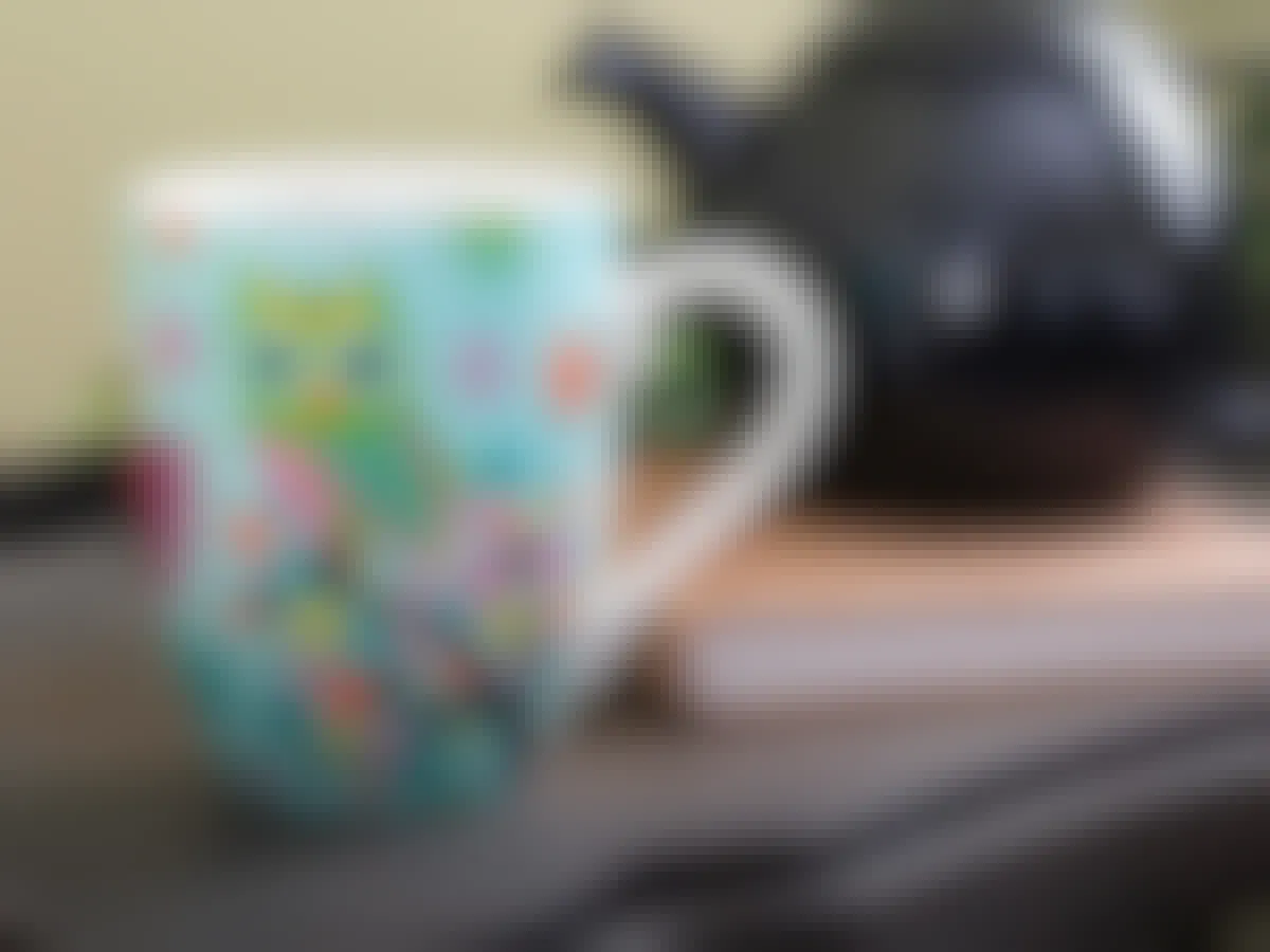 gifts for teens - A mug with an Owl design on a table next to a teapot