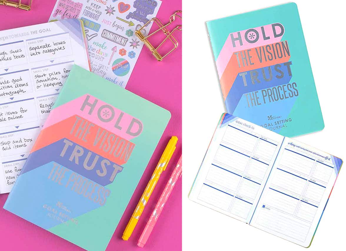 A colorful day planner with the words "hold the vision, trust the process" on the cover