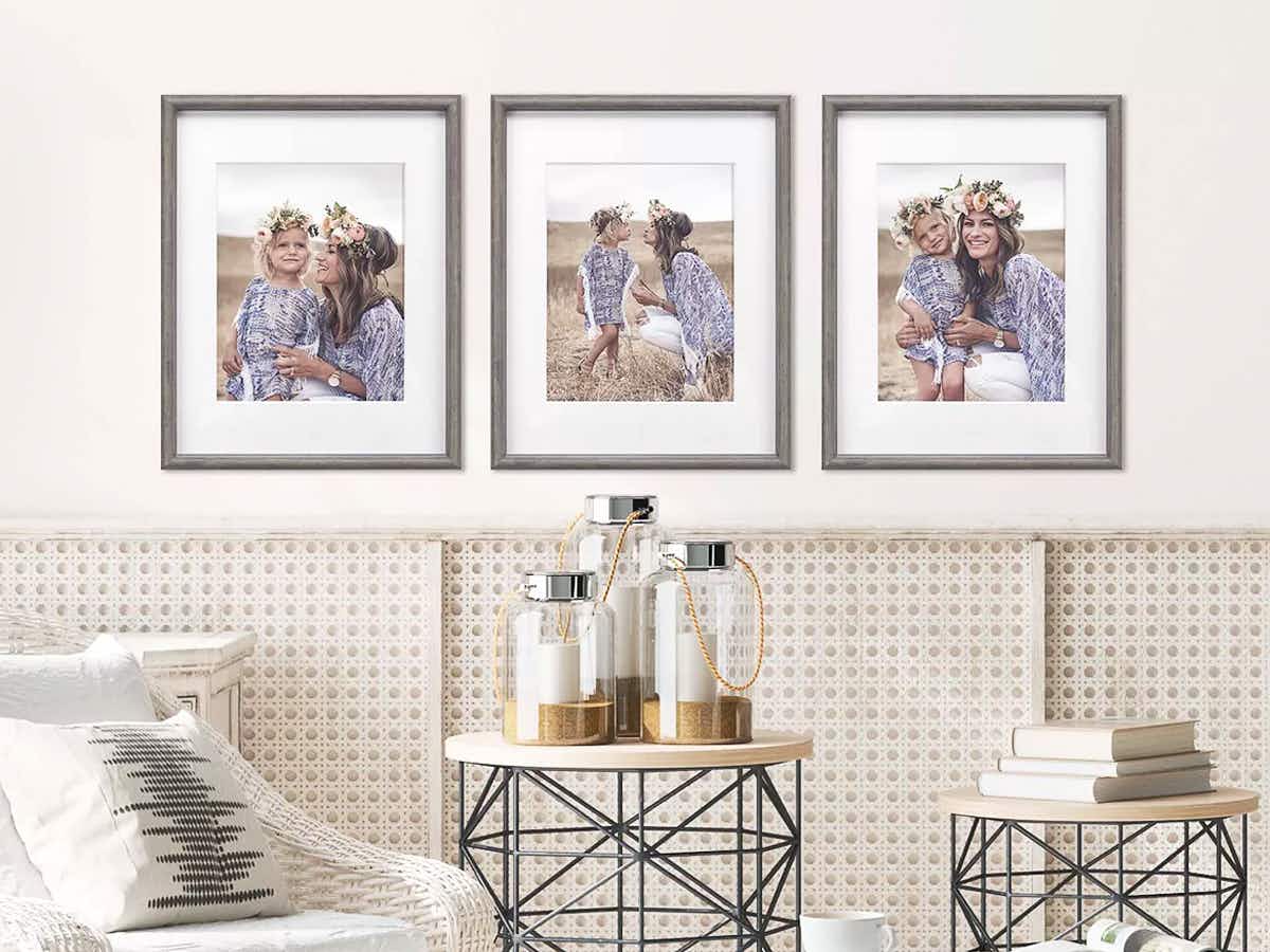 Three photos in frames hanging in a living room