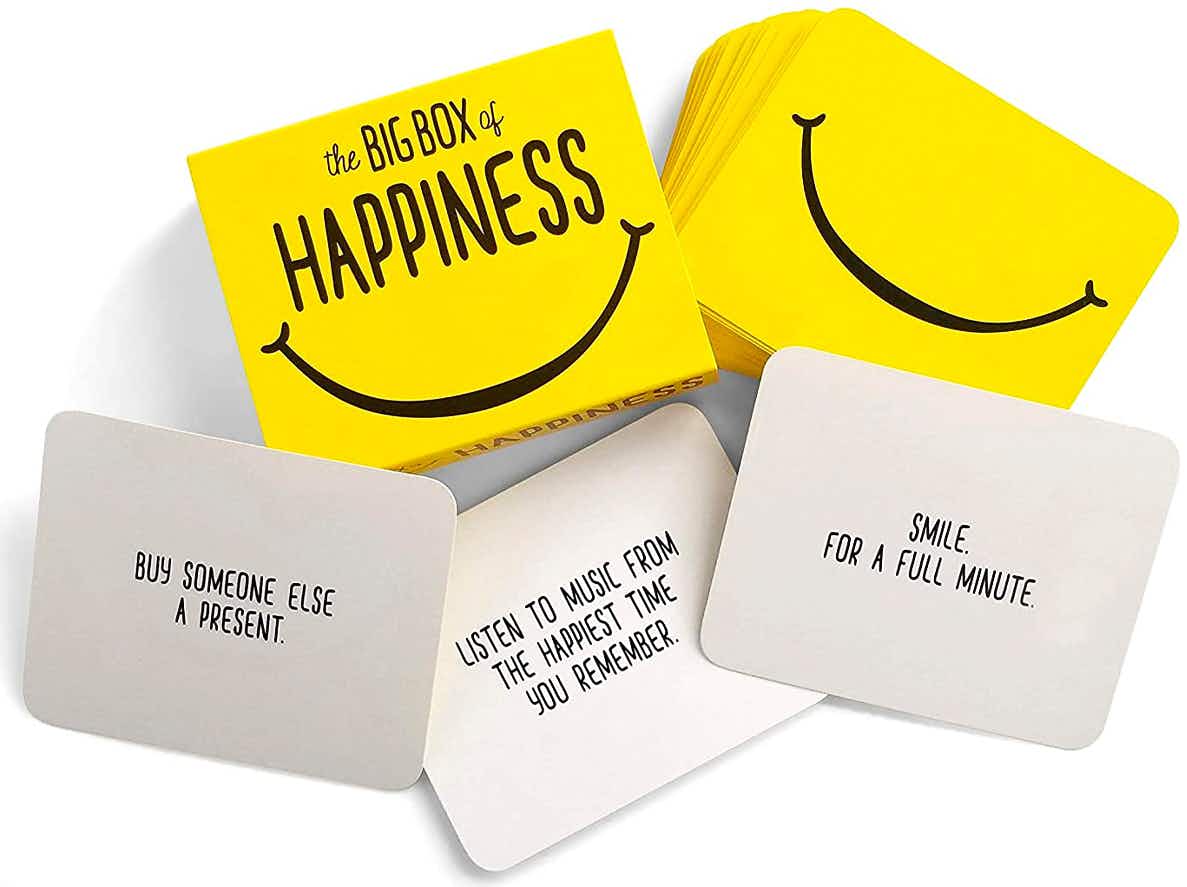 secret santa gifts - A Box of Happiness card game on a white table