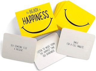 secret santa gifts - A Box of Happiness card game on a white table