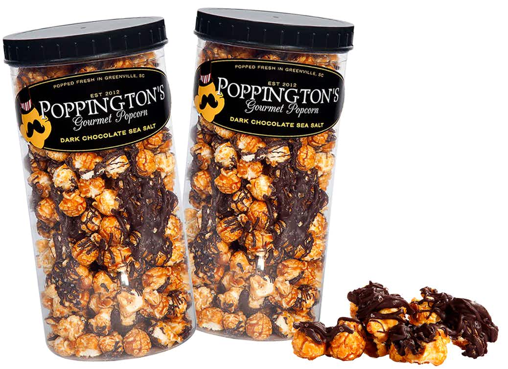 secret santa gifts - Some containers of Poppington's Gourmet Popcorn and some loose popcorn on a white background