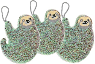 Three sloth shaped sponges on a white background