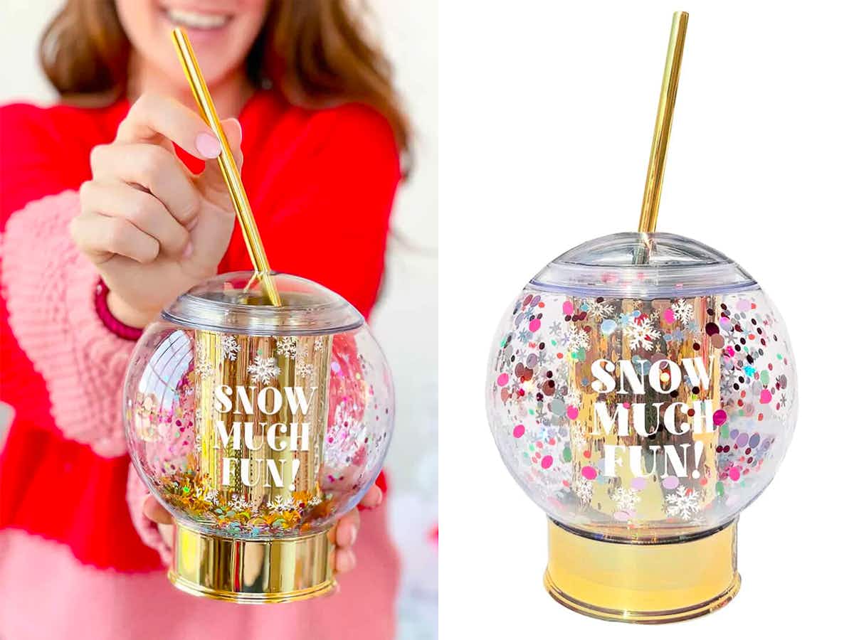 a snowglobe party cup with a straw that says "Snow Much Fun!" on the front.