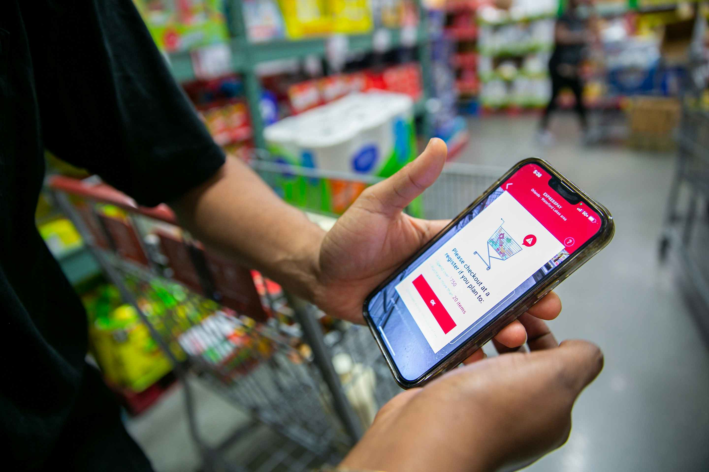 Someone looking at their cart on a phone in BJ's