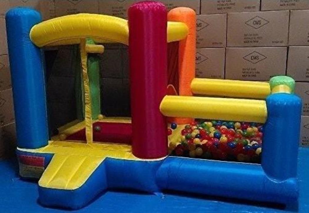 A My Bouncer Little Castle bounce house in a warehouse
