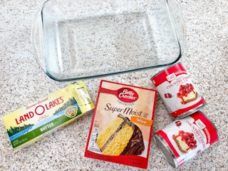 ingredients to make a cherry dump cake on a counter