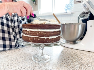 a person making a layered cake