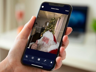 Someone looking at the Christmas Tree Shops Facebook page on their phone