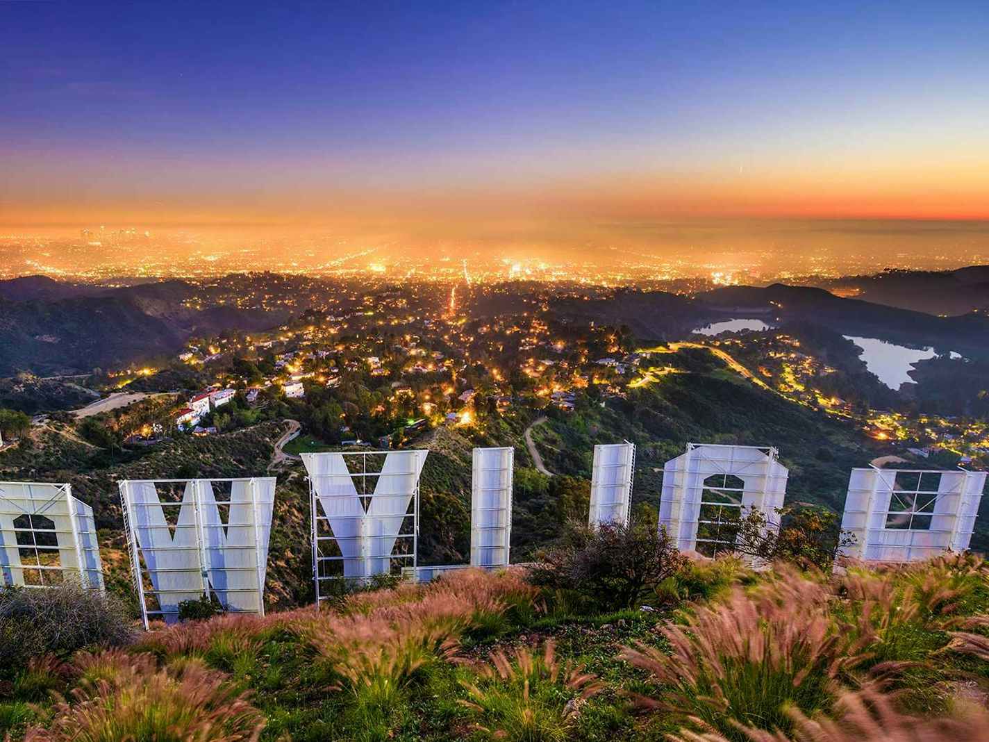 back of hollywood sign overlooking los angeles california at dusk